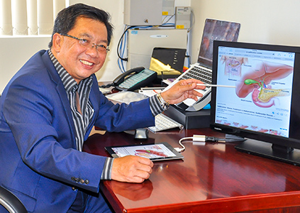 Mr Ahmad in his office